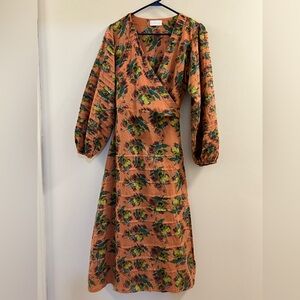 Emslie floral print wrap dress featuring pleated balloon sleeves.